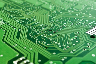 Image showing tracks on the reverse side of a blank (unpopulated) printed circuit board (PCB).